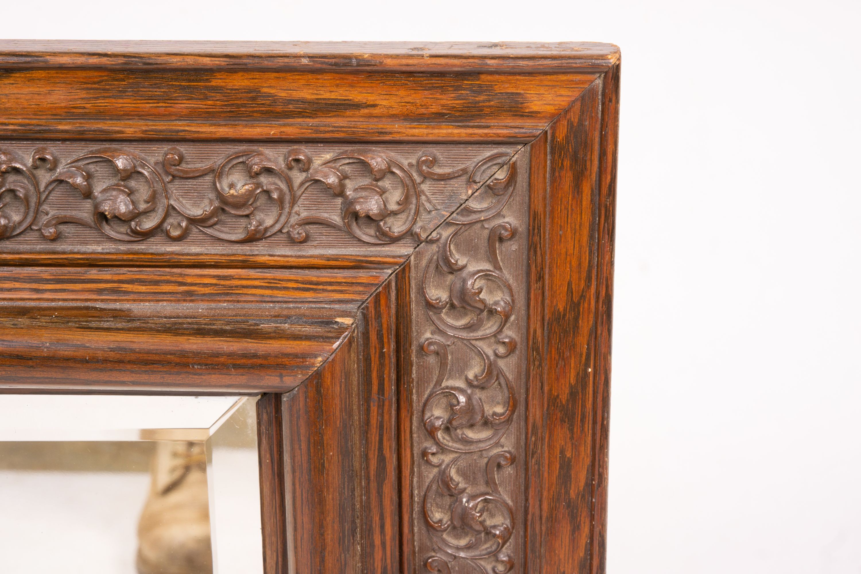 An early 20th century carved oak rectangular wall mirror, width 57cm, height 64cm